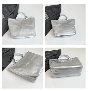Four views of a metallic silver Dupont paper tote bag showing capacity and texture details