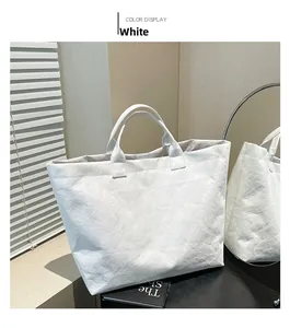 Detail of white Dupont paper tote bag with unique crinkle texture and large capacity