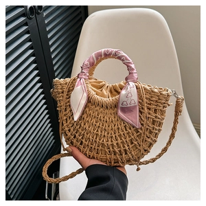 Handwoven straw handbag for women with silk scarf detail and adjustable shoulder strap