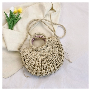 Handmade beige woven straw crescent bag with round handle and floral silk scarf detail