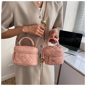 Pink quilted leather chain bags with camellia metal detail in two sizes for women