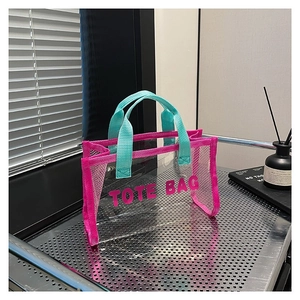 Summer transparent PVC tote bag with pink mesh and green handles for beach travel
