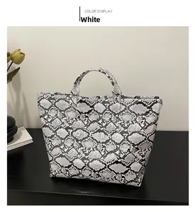 Detail of snake skin texture and Tote Bag printing on large capacity handbag