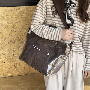 Minimalist transparent PVC tote bag with brown interior lining and white tote bag text