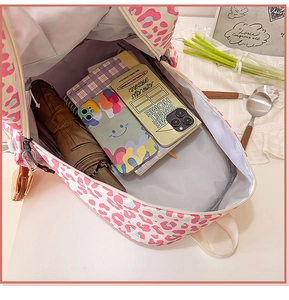 Top view showing the large capacity and internal storage of the leopard print backpack