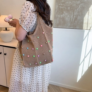 Handmade woven tote bag with colorful pearls for summer beach vacations and daily outings
