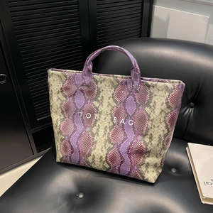 Chic tote bag in purple and grey snake skin pattern with a stylish TOTE BAG print