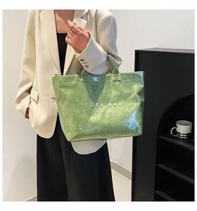 Detail view of the light green tote bag made of waterproof wrinkled DuPont paper material