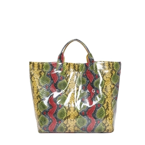 Chic multi-color snake print tote bag with glossy finish and bold TOTE BAG lettering