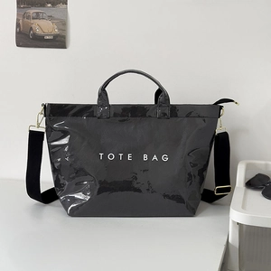 Glossy black square tote bag with TOTE BAG print and adjustable wide shoulder strap