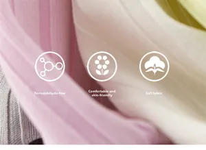 Macro shot of soft pink cotton fabric detail showing breathable skin-friendly texture