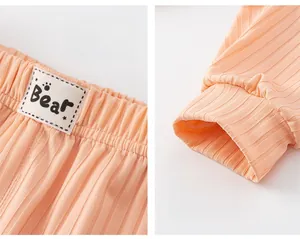Detail of ribbed toddler joggers featuring elastic waistband and side Bear tag