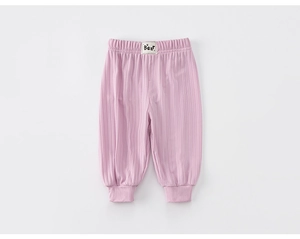 Detail of pink ribbed cotton mosquito pants for toddlers featuring elastic waist and Bear label