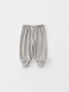 Gray rib-knit toddler mosquito pants with elastic waist and bear patch detail