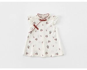Detailed view of Chinese qipao dress with red pear patterns and lace sleeves