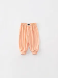 Casual coral pink knit jogger pants for toddler girls with elastic waist and ribbed texture