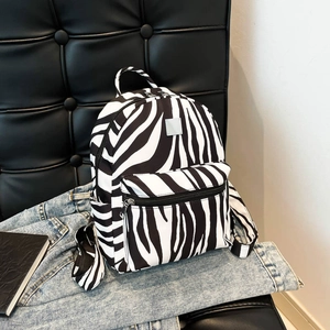 Fashionable zebra print backpack with front zipper pocket for daily casual use
