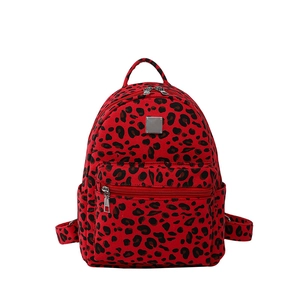 Fashionable red leopard print backpack with large capacity and silver metal plate detail