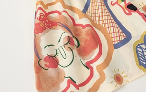 Dettaglio di motivi graffiti astratti artistici su tessuto beige per abito a trapezio bambina