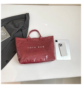 Chic burgundy waterproof DuPont paper tote bag shown with an iPad for size reference