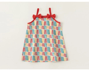 Detail of colorful vertical striped cotton dress with red shoulder bows and straps