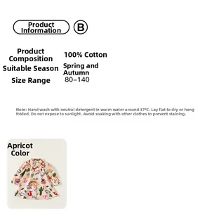 Détail de la robe pour enfants en coton abricot avec motifs de renards et arcs-en-ciel