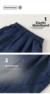 Macro detail showing the elastic waistband and reinforced stitching on boys denim shorts