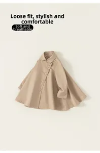 Detailed flat lay of a girls khaki cloak-style trench coat with double-breasted buttons