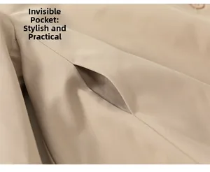 Detail shot of khaki trench coat featuring a hidden pocket and fine plain weave texture