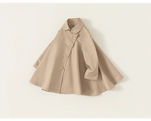 Detail view of a beige A-line poncho trench coat for girls with four front buttons