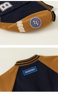 Detailed embroidery on baseball jacket sleeve with ribbed cuffs and contrast fabric