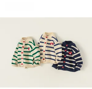 Detail of three striped knit cardigans with red contrast buttons and square chest patch