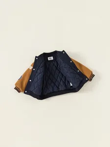 Kids navy and ginger varsity baseball jacket with quilted lining and sleeve patches