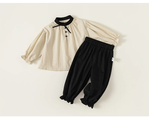 Detail of children's cotton-linen two-piece set with bubble sleeves and joggers