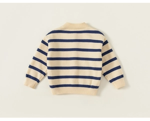 Close-up of ribbed cuffs and striped knit texture on a navy and white girl cardigan
