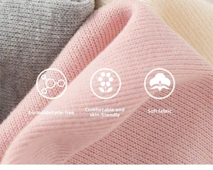 Close-up of soft knit fabric in grey, pink, and beige with skin-friendly texture