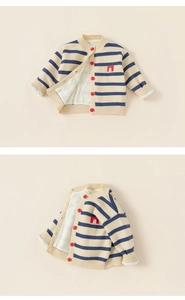 Detailed view of kids striped knit cardigan with vibrant red buttons and cotton lining