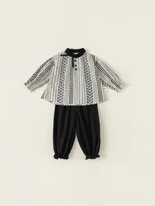 Kids long sleeve shirt and pants set with floral patterns and black bow detail