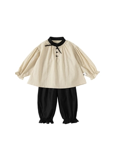 Girl's retro cotton set featuring puff sleeve cream top with bow and black jogger pants
