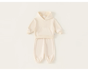 Detailed flat lay of a soft cream toddler hooded sweatshirt and elastic jogger pants set