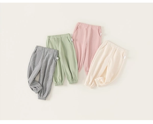 Flat lay of colorful children joggers showing soft knit fabric and ribbed ankle cuffs