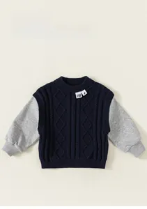 Detail of boys knit sweater and grey sweatshirt sleeve splicing with cable texture