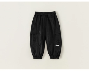 Detailed flat lay of black cargo pants featuring elastic waistband and side patch pockets