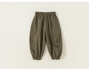 Detail view of olive green cargo pants with elastic waistband and brand woven label