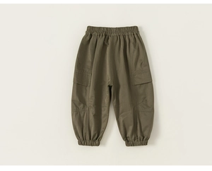 Detail of army green kids cargo pants featuring elastic waist and large side pockets