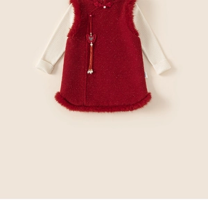 Detail of child's red qipao dress with traditional buttons and white faux fur trim