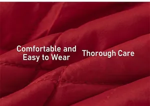 Detailed macro view of red quilted fabric with neat diamond stitching on the dress