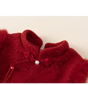 Macro detail of red girls' princess dress featuring Chinese collar, frog button and pearl