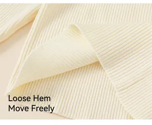 Detailed macro view of the cream ribbed knit texture on a traditional girls' dress hem