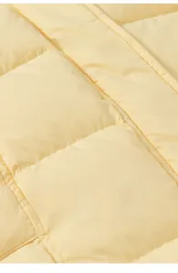 Macro view of light yellow quilted fabric showing soft texture and stitching detail